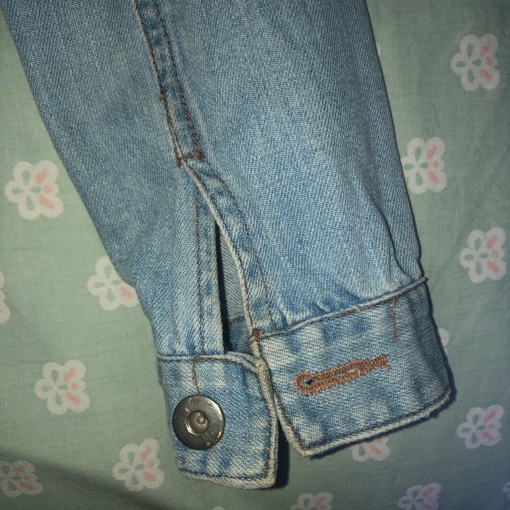 Jean jacket with studded shoulder detail